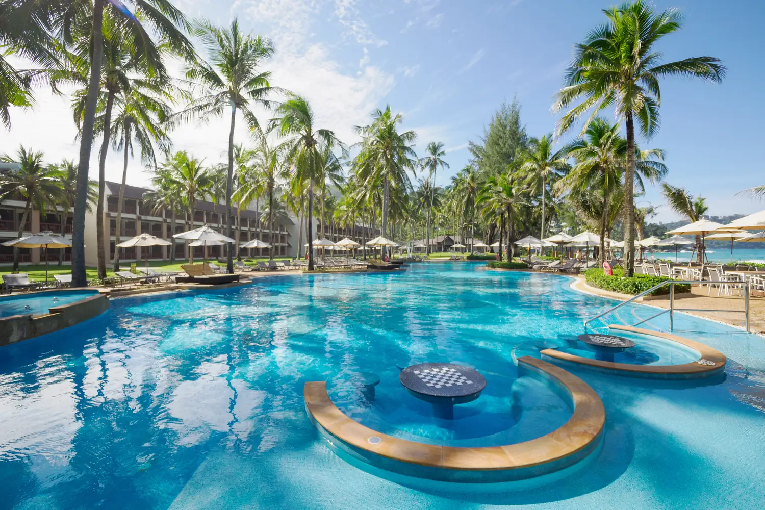 Poolside loungers facing the sea